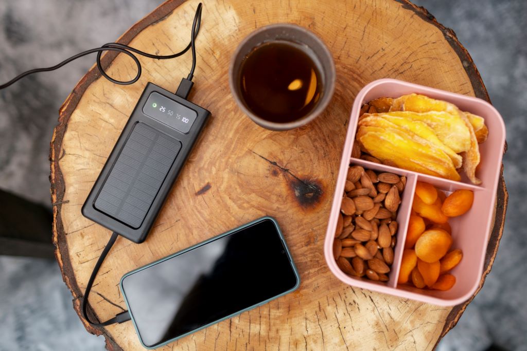 Solar-Powered Phone Chargers for Camping (2025): Features, Pros & Cons vs. Regular Chargers